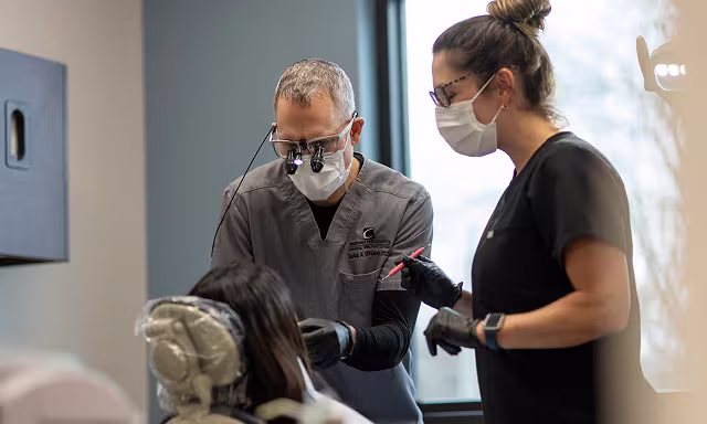 Lancaster periodontist Dr. Joshua Christman performing a specialized dental surgery
